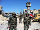 Syrian soldiers stand in the main square of the western city of Qusair. Government troops recaptured the town on Wednesday after rebels had held it for more than a year. It's seen as a significant victory for President Bashar Assad's government. Syrian soldiers stand in the main square of the western city of Qusair. Government troops recaptured the town on Wednesday after rebels had held it for more than a year. It's seen as a significant victory for President Bashar Assad's government.