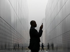 A man takes a photograph with his cell phone of names on the walls of "Empty Sky Memorial" at Liberty State Park in Jersey City, New Jersey. The concrete and steel memoria pays tribute to the 746 citizens of New Jersey who lost their lives on Sept. 11. A man takes a photograph with his cell phone of names on the walls of "Empty Sky Memorial" at Liberty State Park in Jersey City, New Jersey. The concrete and steel memoria pays tribute to the 746 citizens of New Jersey who lost their lives on Sept. 11.