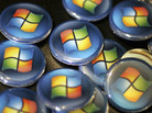 Buttons with the Microsoft logo are seen at a Comp USA store in 2007. Buttons with the Microsoft logo are seen at a Comp USA store in 2007.