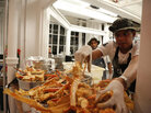 Chef Roblé Ali prepares crabs for an event with singer-songwriter John Legend. Chef Roblé Ali prepares crabs for an event with singer-songwriter John Legend.
