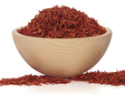 Saffron is a stringy red spice made from the dried stigma of a saffron flower. Saffron is a stringy red spice made from the dried stigma of a saffron flower.