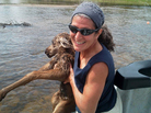 Dr. Karen Sciascia of Red Hill, Pa., holds a baby moose she and Four Rivers Fishing Co. guide Seth McLean rescued from a river in southwestern Montana, in a photo taken just before they released the animal on the bank where its mother waited. Dr. Karen Sciascia of Red Hill, Pa., holds a baby moose she and Four Rivers Fishing Co. guide Seth McLean rescued from a river in southwestern Montana, in a photo taken just before they released the animal on the bank where its mother waited.