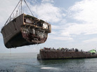 The bow of the mine countermeasure ship Guardian is removed in March in the Sulu Sea, Philippines. The Guardian ran aground on the Tubbataha Reef in January. The bow of the mine countermeasure ship Guardian is removed in March in the Sulu Sea, Philippines. The Guardian ran aground on the Tubbataha Reef in January.
