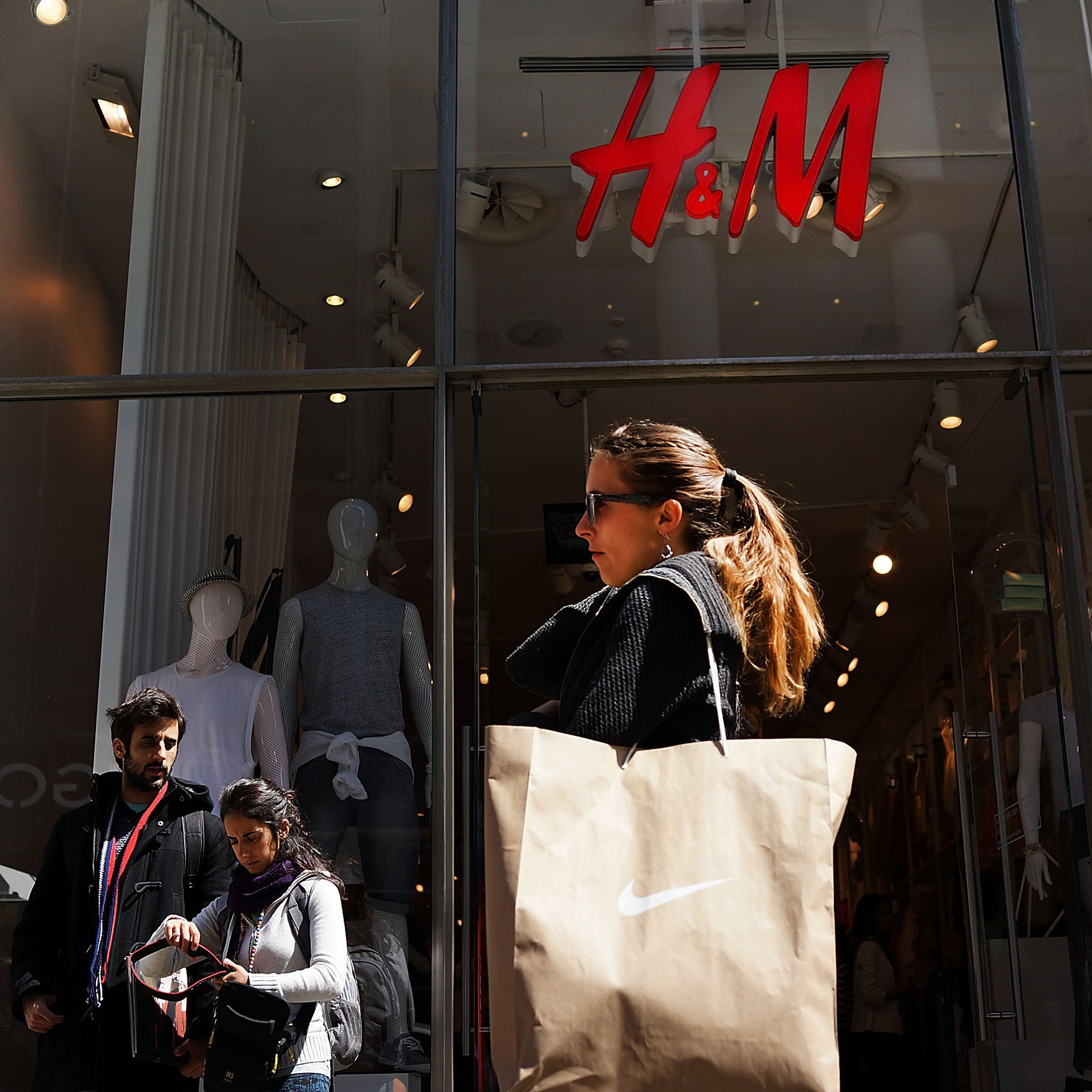 Shoppers walk along Broadway in New York City. Retailers added 28,000 in May amid signs of strength in consumer spending.