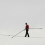 With no net below, Nik Wallenda walks a 1,000-foot-long high wire, suspended 200 feet over the Allegheny River in downtown Pittsburgh in 2009.