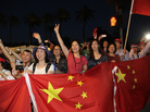 Supporters of Chinese President Xi Jinping cheer as they watch his motorcade arrive in Indian Wells, Calif., on Thursday. Supporters of Chinese President Xi Jinping cheer as they watch his motorcade arrive in Indian Wells, Calif., on Thursday.