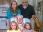 Michael and Katharine Powers don't expect to be able to retire. Here, they are with two of their daughters and Michael's grandfather. Michael and Katharine Powers don't expect to be able to retire. Here, they are with two of their daughters and Michael's grandfather.