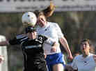 Katherine Cuntz and Sarah Gaudet go up to head the ball during a Louisiana high school championship game in 2011.