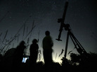 Tonight might bring the best chance to view the gamma Delphinid meteor shower in the United States since 1930, according to NASA. Here, astronomers watch the night sky for the Perseid meteor shower, in a file photo. Tonight might bring the best chance to view the gamma Delphinid meteor shower in the United States since 1930, according to NASA. Here, astronomers watch the night sky for the Perseid meteor shower, in a file photo.