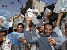 Supporters of Saeed Jalili, Iran's top nuclear negotiator and a candidate in Iran's June 14 presidential election, attend a street campaign after Friday prayers in Tehran on June 7. Supporters of Saeed Jalili, Iran's top nuclear negotiator and a candidate in Iran's June 14 presidential election, attend a street campaign after Friday prayers in Tehran on June 7.
