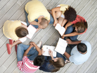 A group of young adults reading A group of young adults reading