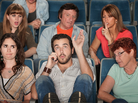 Man on the phone in a theater. Man on the phone in a theater.