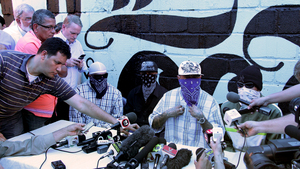 Members of the 18th Street gang announce a truce during a press conference at a prison in San Pedro Sula on May 28.