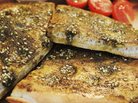 Lebanese bread topped with za'atar, a spice mix ubiquitous in the Middle East. Lebanese bread topped with za'atar, a spice mix ubiquitous in the Middle East.