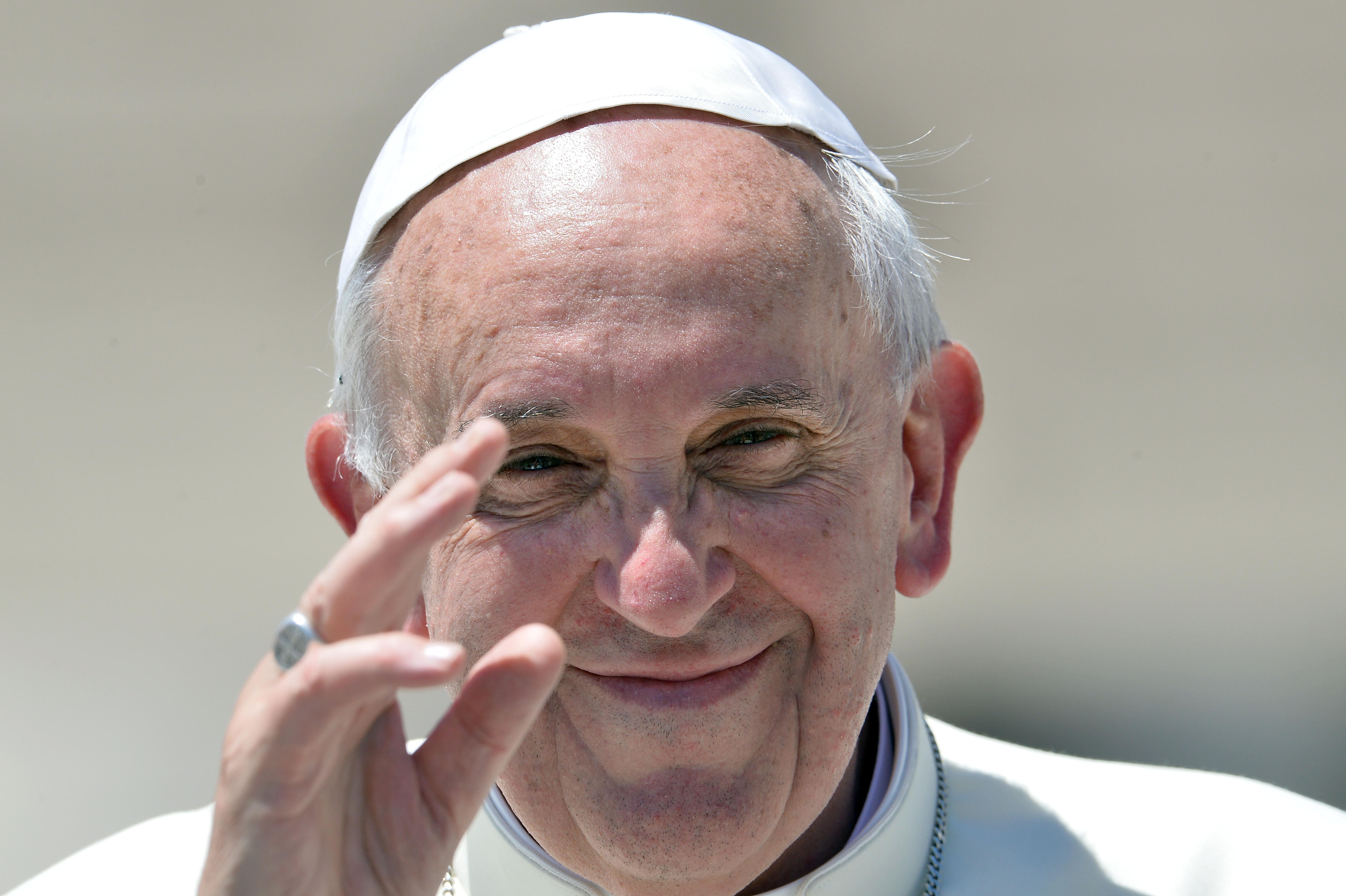 Pope Francis leaves after his weekly general audience in St Peter's square at the Vatican on June 12, 2013.