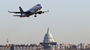 A jet takes off from Reagan National Airport, near the Capitol.