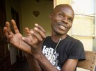 David Kato, a teacher and LGBT rights activist — as well as the first openly gay man in Uganda — is at the forefront of Call Me Kuchu's story. David Kato, a teacher and LGBT rights activist — as well as the first openly gay man in Uganda — is at the forefront of Call Me Kuchu's story.