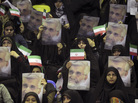 Female supporters of Iranian presidential candidate Saeed Jalili, Iran's top nuclear negotiator, hold up posters and national flags at a campaign rally in Tehran, Iran, on May 24. Jalili advocates for traditional roles for women and resistance against the U.S. Female supporters of Iranian presidential candidate Saeed Jalili, Iran's top nuclear negotiator, hold up posters and national flags at a campaign rally in Tehran, Iran, on May 24. Jalili advocates for traditional roles for women and resistance against the U.S.