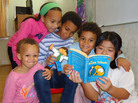 Carina Jaffe, 3; Larissa Jaffe, 9; Denali Jaffe, 10; Zahra Jaffe, 6; and their friend Christina Tonnu, 8, read The Phantom Tollbooth together in Philadelphia. Carina Jaffe, 3; Larissa Jaffe, 9; Denali Jaffe, 10; Zahra Jaffe, 6; and their friend Christina Tonnu, 8, read The Phantom Tollbooth together in Philadelphia.