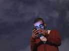 A protestor with a gas mask uses a mobile phone to read the news on social media as demonstrators gather at midnight Thursday in Istanbul's Taksim Gezi Park. A protestor with a gas mask uses a mobile phone to read the news on social media as demonstrators gather at midnight Thursday in Istanbul's Taksim Gezi Park.