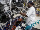 A worker installs parts on a Chrysler SUV engine at the Jefferson North Assembly Plant in Detroit. Plants in the U.S. are now operating above 90 percent capacity, but automakers are wary of adding large numbers of new workers. A worker installs parts on a Chrysler SUV engine at the Jefferson North Assembly Plant in Detroit. Plants in the U.S. are now operating above 90 percent capacity, but automakers are wary of adding large numbers of new workers.