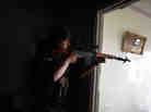 A Syrian rebel aims his sniper rifle at Syrian government forces in the Sheikh Maqsud district of Aleppo, in April. A Syrian rebel aims his sniper rifle at Syrian government forces in the Sheikh Maqsud district of Aleppo, in April.