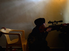 A Syrian female rebel monitors the movement of Syrian government forces in the Sheikh Maqsud district of the northern Syrian city of Aleppo in April. A Syrian female rebel monitors the movement of Syrian government forces in the Sheikh Maqsud district of the northern Syrian city of Aleppo in April.