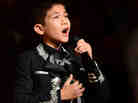 Sebastien de la Cruz, known as San Antonio's Little Mariachi, sings the national anthem before the start of Game 4 of the NBA finals on Thursday. Sebastien de la Cruz, known as San Antonio's Little Mariachi, sings the national anthem before the start of Game 4 of the NBA finals on Thursday.