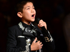 Sebastien de la Cruz, known as San Antonio's Little Mariachi, sings the national anthem before the start of Game 4 of the NBA finals on Thursday. Sebastien de la Cruz, known as San Antonio's Little Mariachi, sings the national anthem before the start of Game 4 of the NBA finals on Thursday.