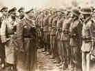 A June 3, 1944, photo provided by the U.S. Holocaust Memorial Museum shows SS chief Heinrich Himmler (center) as he reviews troops of the Galician SS-Volunteer Infantry Division. A June 3, 1944, photo provided by the U.S. Holocaust Memorial Museum shows SS chief Heinrich Himmler (center) as he reviews troops of the Galician SS-Volunteer Infantry Division.