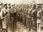 A June 3, 1944, photo provided by the U.S. Holocaust Memorial Museum shows SS chief Heinrich Himmler (center) as he reviews troops of the Galician SS-Volunteer Infantry Division. A June 3, 1944, photo provided by the U.S. Holocaust Memorial Museum shows SS chief Heinrich Himmler (center) as he reviews troops of the Galician SS-Volunteer Infantry Division.
