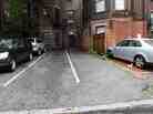 Parking spaces behind 298 Commonwealth Avenue in Boston are seen Friday. The two open spaces at right, front and back, were sold at auction for $560,000. Parking spaces behind 298 Commonwealth Avenue in Boston are seen Friday. The two open spaces at right, front and back, were sold at auction for $560,000.