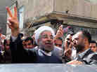 Moderate presidential candidate, Hasan Rowhani, a former nuclear negotiator, flashes the victory sign as he leaves a polling station in Tehran on Friday. Moderate presidential candidate, Hasan Rowhani, a former nuclear negotiator, flashes the victory sign as he leaves a polling station in Tehran on Friday.