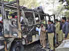Pakistani police officers and volunteers gather at the wreckage of a bus destroyed in a bomb blast in Quetta, Pakistan, on Saturday. Pakistani police officers and volunteers gather at the wreckage of a bus destroyed in a bomb blast in Quetta, Pakistan, on Saturday.
