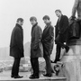 The Beatles pose in Liverpool's Derby Square in February 1963 — the year, according to author Colin Fleming, that yielded the band's most definitive work.