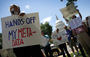Protesters gather outside the U.S. Capitol on Thursday to rally against the National Security Agency's recently detailed surveillance programs.