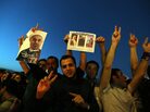 Iranians celebrate the victory of moderate presidential candidate Hasan Rowhani (portrait) at Vanak square in northern Tehran on Saturday. Iranians celebrate the victory of moderate presidential candidate Hasan Rowhani (portrait) at Vanak square in northern Tehran on Saturday.