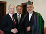 Then-U.S. ambassador to Afghanistan Ryan Crocker (left) shakes hands with Afghan President Hamid Karzai in 2011. During his 37 years as a diplomat, Crocker served as ambassador to six Muslim countries.