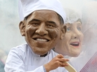 Oxfam charity volunteers wear masks depicting G-8 leaders President Obama and German Chancellor Merkel around a large caldron to draw attention to the issue of world hunger in Northern Ireland on Sunday. G-8 leaders are gathering there for an annual summit. Oxfam charity volunteers wear masks depicting G-8 leaders President Obama and German Chancellor Merkel around a large caldron to draw attention to the issue of world hunger in Northern Ireland on Sunday. G-8 leaders are gathering there for an annual summit.