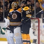 Patrice Bergeron #37 of the Boston Bruins celebrates with Tuukka Rask #40 after defeating the Chicago Blackhawks 2-0 in Game 3 of the NHL Stanley Cup Final at TD Garden Monday night in Boston.
