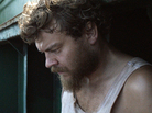 Pilou Asbaek (right) plays ship's cook Mikkel, a new dad who desperately wishes to return to his family, but is instead forced to prepare menus at gunpoint as the cargo vessel's owners negotiate for its release. Pilou Asbaek (right) plays ship's cook Mikkel, a new dad who desperately wishes to return to his family, but is instead forced to prepare menus at gunpoint as the cargo vessel's owners negotiate for its release.