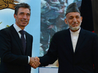 Afghan President Hamid Karzai shakes hands with NATO Secretary-General Anders Fogh Rasmussen after a security handover ceremony at a military academy outside Kabul on Tuesday. Afghan President Hamid Karzai shakes hands with NATO Secretary-General Anders Fogh Rasmussen after a security handover ceremony at a military academy outside Kabul on Tuesday.