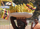 A woman sells bananas at the Kampala Airport. Ugandans eat about a pound of the fruit, on average, per day. A woman sells bananas at the Kampala Airport. Ugandans eat about a pound of the fruit, on average, per day.