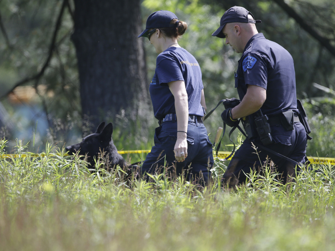 Law enforcement officials search an area in Oakland Township, Mich., on Tuesday for the remains of Teamsters union President Jimmy Hoffa who was last seen at a Detroit-area restaurant in 1975.