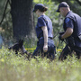 Law enforcement officials search an area in Oakland Township, Mich., on Tuesday for the remains of Jimmy Hoffa. The former Teamsters president was last seen at a Detroit-area restaurant in 1975. Law enforcement officials search an area in Oakland Township, Mich., on Tuesday for the remains of Jimmy Hoffa. The former Teamsters president was last seen at a Detroit-area restaurant in 1975.