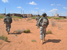 Soldiers advance toward a simulated Afghan town during a training exercise at Fort Bliss in El Paso, Texas, in 2012. While the suicide rate is rising in the military, it's declining for troops stationed at Fort Bliss, thanks in part to efforts to ramp up suicide awareness and prevention training. Soldiers advance toward a simulated Afghan town during a training exercise at Fort Bliss in El Paso, Texas, in 2012. While the suicide rate is rising in the military, it's declining for troops stationed at Fort Bliss, thanks in part to efforts to ramp up suicide awareness and prevention training.
