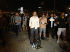 Erdem Gunduz (center) stands in Instanbul's Taksim Square early Tuesday. After weeks of clashes with police, many Turkish protesters were inspired to emulate Gunduz, and stand silently. Erdem Gunduz (center) stands in Instanbul's Taksim Square early Tuesday. After weeks of clashes with police, many Turkish protesters were inspired to emulate Gunduz, and stand silently.