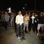 Erdem Gunduz (center) stands in Instanbul's Taksim Square early Tuesday. After weeks of clashes with police, many Turkish protesters were inspired to emulate Gunduz, and stand silently. Erdem Gunduz (center) stands in Instanbul's Taksim Square early Tuesday. After weeks of clashes with police, many Turkish protesters were inspired to emulate Gunduz, and stand silently.