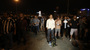 Erdem Gunduz (center) stands in Instanbul's Taksim Square early Tuesday. After weeks of clashes with police, many Turkish protesters were inspired to emulate Gunduz, and stand silently.