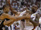 LeBron James (right) of the Miami Heat snatches the ball from Tim Duncan of the San Antonio Spurs during overtime in Game 6 of the NBA Finals at the American Airlines Arena in Miami.
